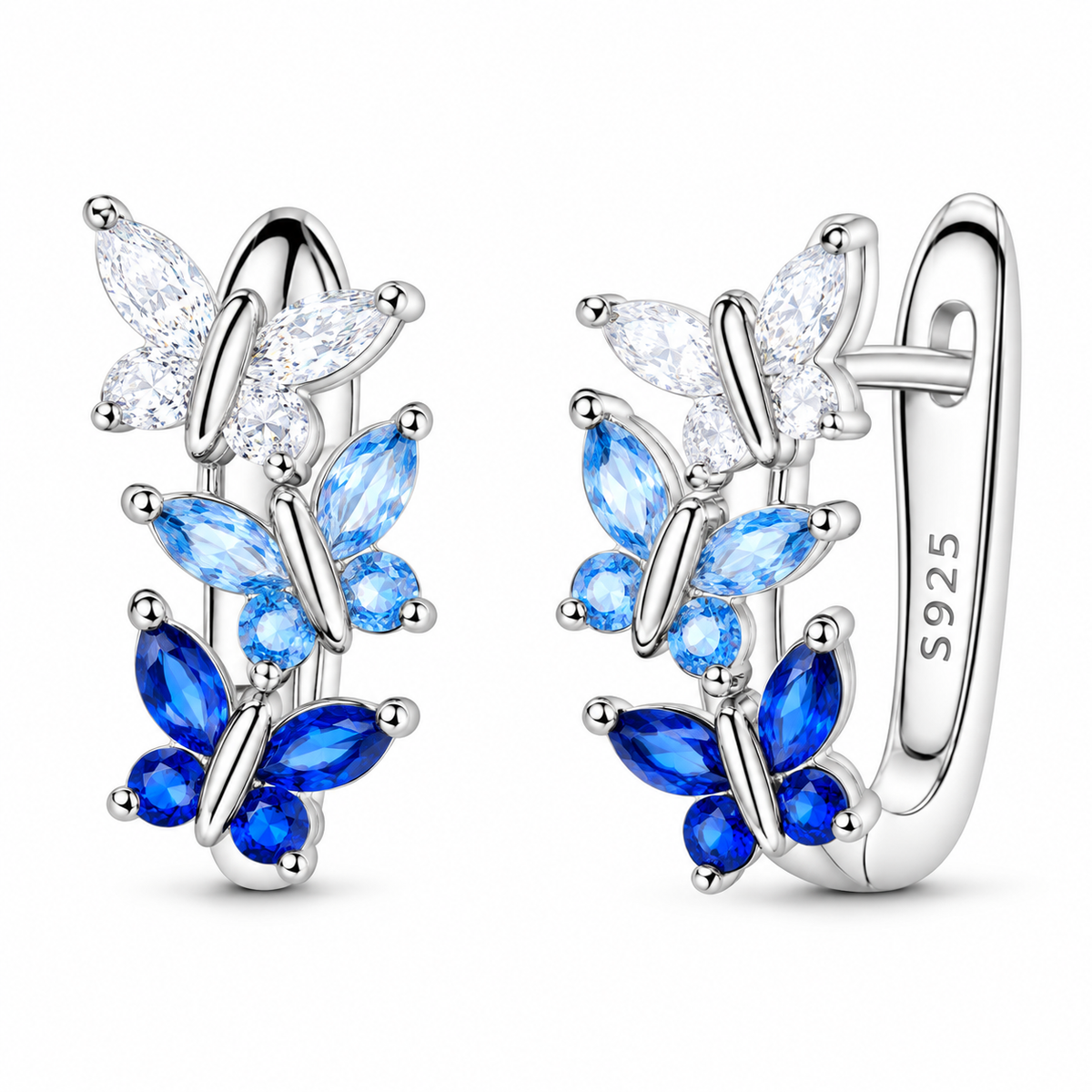 Sterling silver huggie earrings with three butterflies in clear, pale blue and deep blue faceted accents